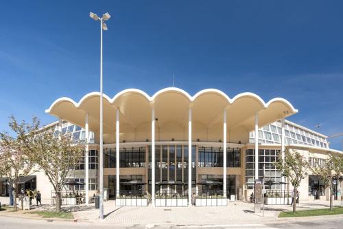 a large white building with white columns at Julio Dinis Studio in Porto