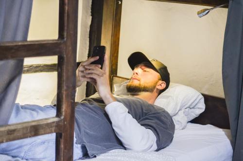 Una cama o camas en una habitación de Coffee Tree Boutique Hostel