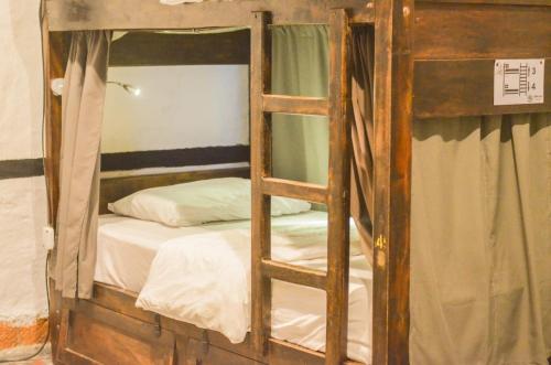 Una cama o camas en una habitación de Coffee Tree Boutique Hostel
