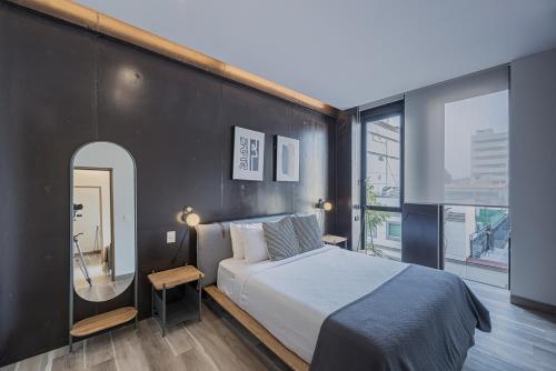 En eller flere senge i et værelse på Cuadra 134 Residencial Condesa