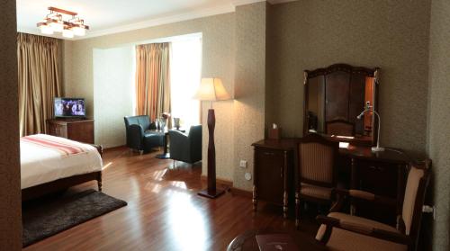 Postel nebo postele na pokoji v ubytování Abyssinia Renaissance Hotel