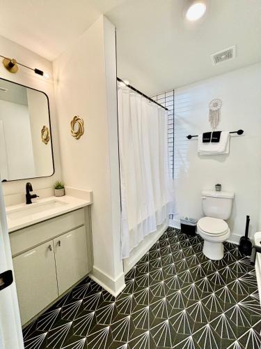 a bathroom with a toilet and a sink and a shower at Opry Mills House Near Grand Ole Opry Air Hockey in Nashville