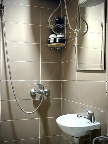 a bathroom with a shower and a sink at Apartment Code in Sarajevo