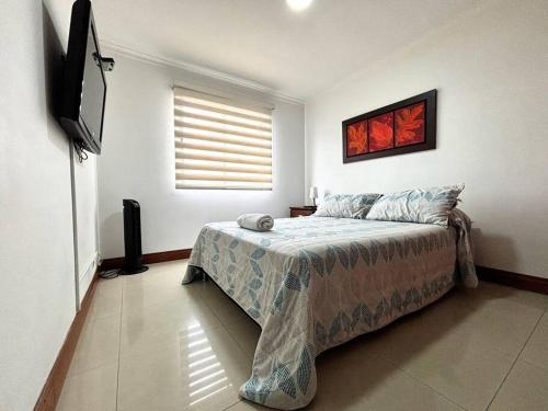 Ένα ή περισσότερα κρεβάτια σε δωμάτιο στο Serene Laureles