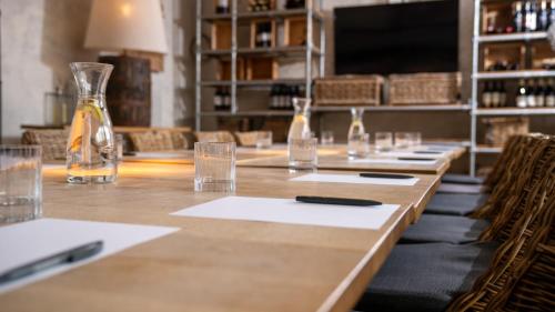 a long table with glasses and a bottle on it at The Castle Inn in Harrogate