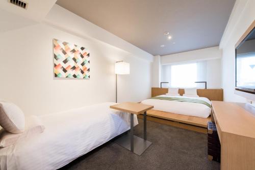 Postel nebo postele na pokoji v ubytování Hotel Mystays Premier Hamamatsucho