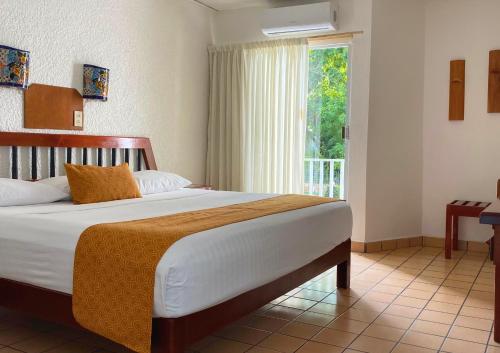 Un ou plusieurs lits dans un hébergement de l'établissement Hotel Maya Palenque