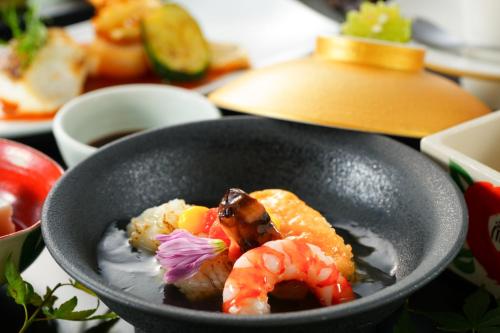 a bowl of food with shrimp and other foods at Hana Beppu in Beppu