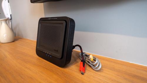 a black speaker sitting on top of a wooden table at Apezinho Moema in Sao Paulo