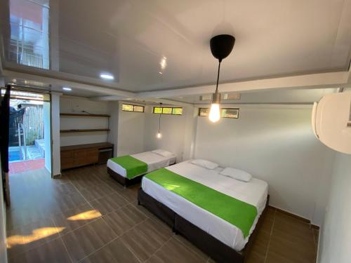 a bedroom with two beds in a room at Hotel Sol del Desierto in Villavieja