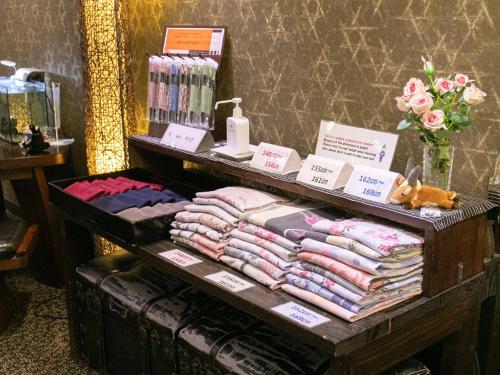 a display of clothes on a table in a store at Yufuin Besso Shikisai Hotel in Yufuin