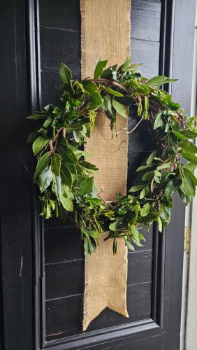 a wreath on the door of a black door at Belle Ame in Takapau
