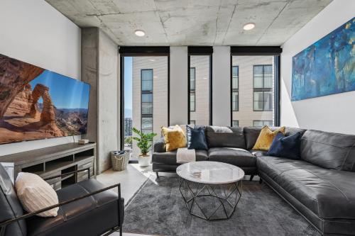 a living room with a couch and a table at Delta Center 2Bd 2Bath Pool Gym! in American Towers Condominium