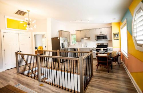 a kitchen and dining room with a table in it at Urban Nest Guest House in Charlotte
