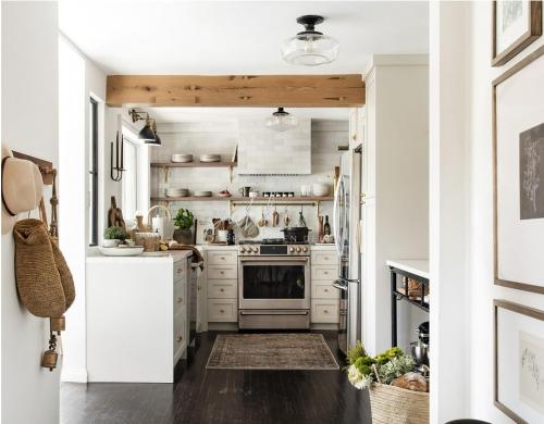 a kitchen with white cabinets and a stove at Zen Treehouse Retreat-Great Views & Peaceful Decks in Los Angeles