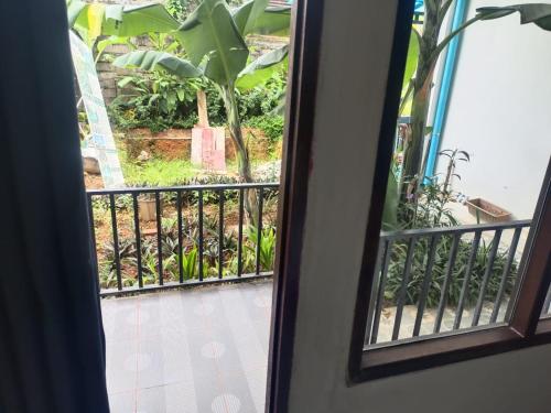 a view of a balcony from a window at Champa House in Vang Vieng