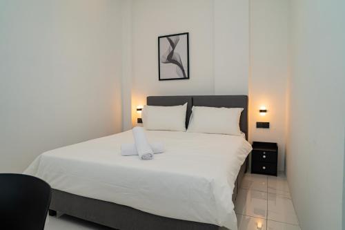 a bedroom with a large bed with white sheets at Jovial Industrial Stylish Lodge ````Bukit Mertajam in Bukit Mertajam