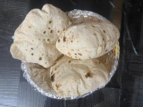 a group of tortillas in a bowl on a grill at Wintry homes 5 Bhk Villa in Shimla
