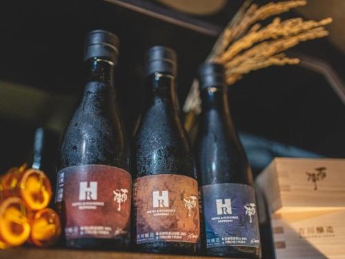 three bottles of beer sitting next to a pair of scissors at Roppongi Hotel S in Tokyo
