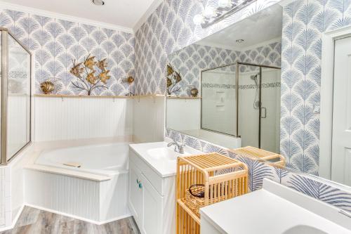 a bathroom with a sink and a mirror at Walk to Marina Pet-Friendly Little River Home! in Little River