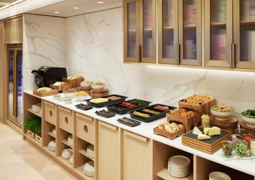 a kitchen with some food on a counter at Lanson Place Parliament Gardens in Melbourne