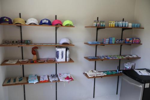 a room with shelves with hats and other items at The Toucan Inn in Independence