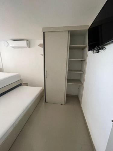 Кровать или кровати в номере Hotel Hernández CTG