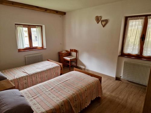 Postel nebo postele na pokoji v ubytování Chalet Nontiscordardime