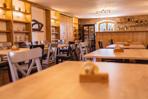 a dining room with tables and chairs in a restaurant at Penzion Benátky in Pelhřimov