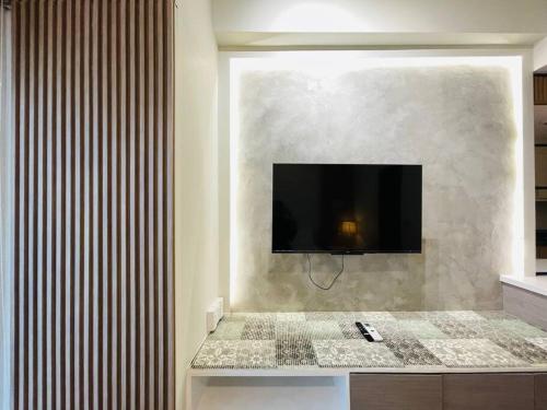 Télévision ou salle de divertissement dans l'établissement 18 Warm Studio Oasis