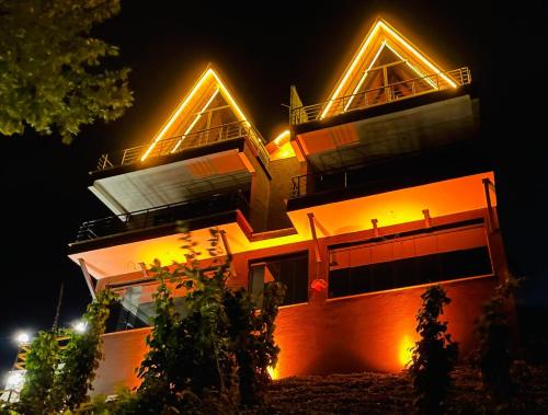 a building with lights on top of it at night at Seyr-i Keyf Suit Bungalov in Rize