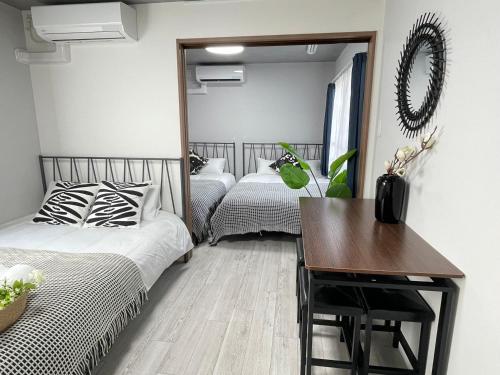 Katil atau katil-katil dalam bilik di COMMA HOUSE Otsuka 202