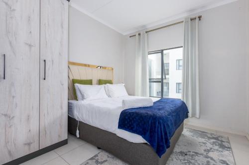 Postel nebo postele na pokoji v ubytování Smartz Apartment