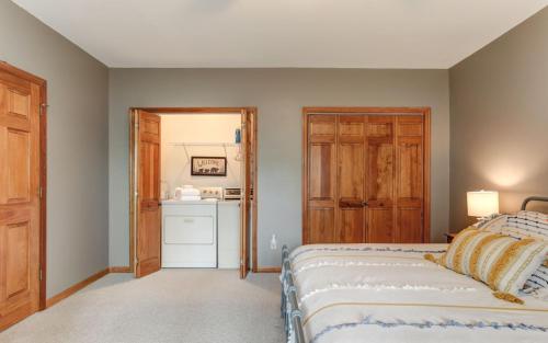 a bedroom with a bed and a kitchen at Wanderers Den - Peaceful mountain views Wifi and homey comforts in Jasper