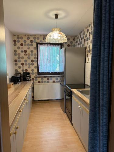 a kitchen with a sink and a counter top at Altmarkblick in Erbenhausen