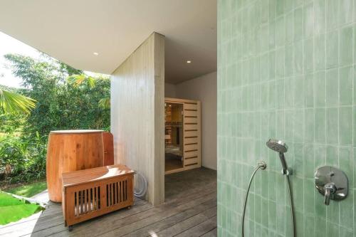 a bathroom with a shower and a shower at Ahoy! 9 Bedroom Villa in Dalung