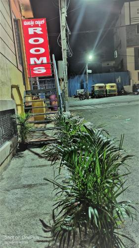 a group of plants in front of a garage at Manjushree Lodging in Bengaluru