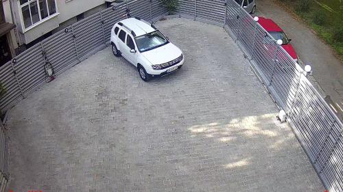 a white car parked in a parking lot at Luxurious House with three Deluxe rooms & Free Parking in Sofia