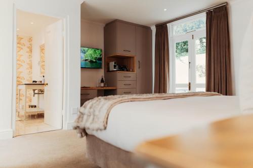 Katil atau katil-katil dalam bilik di Les Chambres Guest House