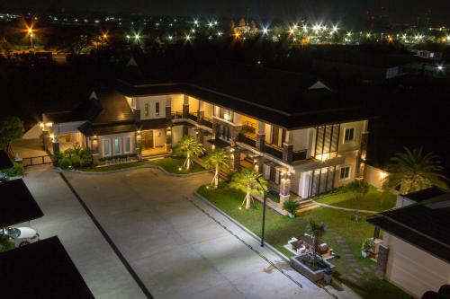 an aerial view of a house at night at Fortune Surin Hotel in Surin