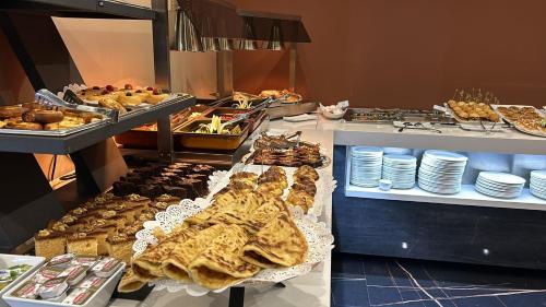 a buffet with many different types of food on display at Hotel BH San Francisco Alicante in Alicante