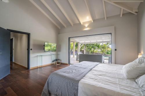 En eller flere senge i et værelse på Villa Cactus