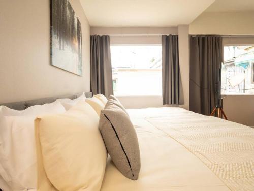 Ένα ή περισσότερα κρεβάτια σε δωμάτιο στο Cozy studio for 3 guests in the heart of Silom - 3B