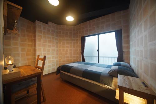 Ένα ή περισσότερα κρεβάτια σε δωμάτιο στο 045 Hostel Yoshidamachi