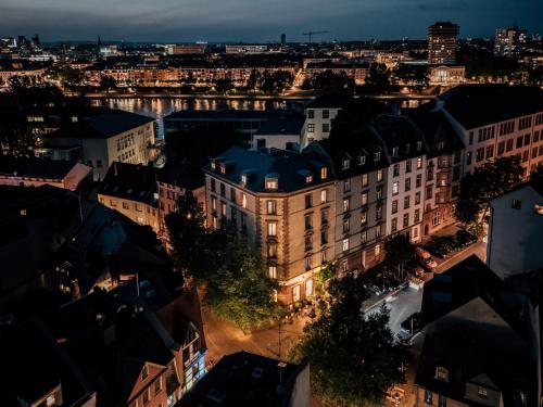 an aerial view of a city at night at Libertine Lindenberg in Frankfurt/Main