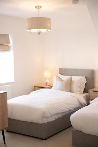 Postel nebo postele na pokoji v ubytování Lonsdale House Boutique Apartments
