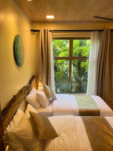Кровать или кровати в номере Holiday Home Dhiffushi