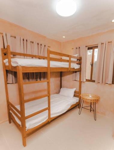 Postel nebo postele na pokoji v ubytování Villa Adara by Araw Residences