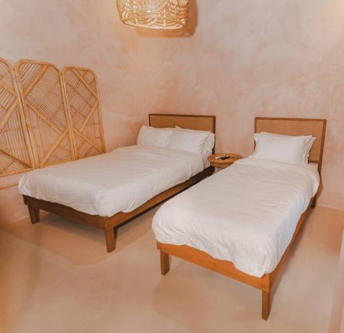 Postel nebo postele na pokoji v ubytování Villa Adara by Araw Residences