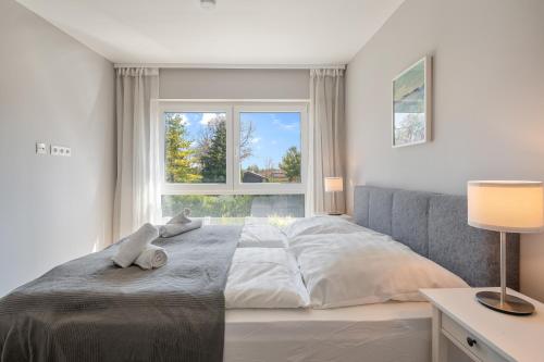 A bed or beds in a room at Vacation Home in Prater - Central, Garden and Sauna